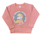 Pink sweatshirt with autumn-themed design.