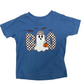 A toddler's blue short-sleeve t-shirt with a Halloween 'BOO' graphic, laid flat on a wooden surface. The graphic features a white ghost wearing a black-and-white checkered hat and holding an orange pumpkin, flanked by checkered 'O' letters, with three black bats above.