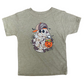 A toddler's heather olive green short-sleeve t-shirt with a Halloween graphic of a ghost wearing a camouflage cap and holding an orange pumpkin bucket, laid flat on a brown wood background.