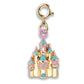 Gold charm shaped like a castle with pink and blue accents