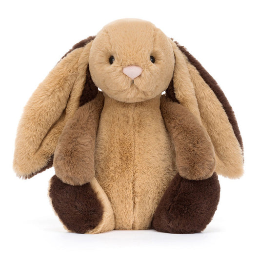 A plush toy bunny with brown and beige fur, a cream-colored bobtail, and a pink nose.