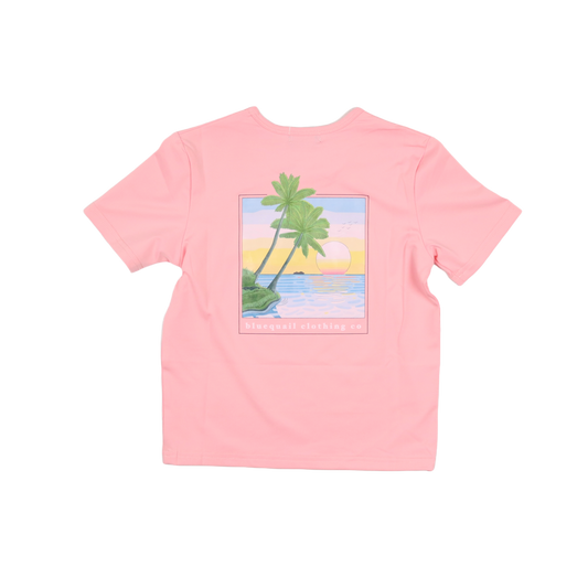 Pink t-shirt with a tropical graphic on a white background