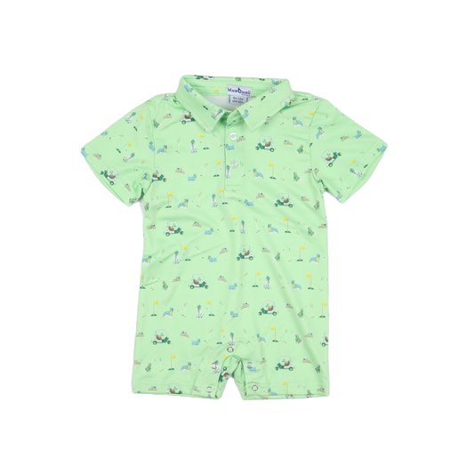 Green baby romper with golf-themed print on a white background