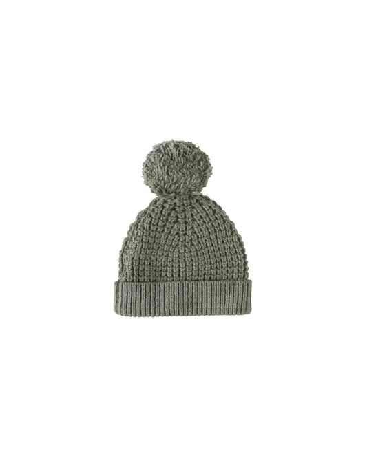Green knitted beanie with pom-pom