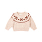 Pink sweater with bow and heart patterns 