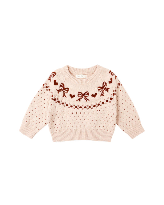Pink sweater with bow and heart patterns 