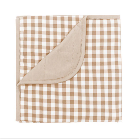 Brown and white checkered blanket 