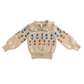 Beige sweater with floral pattern on a white background