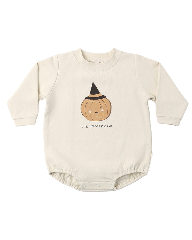 A cream-colored long-sleeve baby bodysuit featuring a cute cartoon pumpkin wearing a black witch hat with the text 'LIL PUMPKIN' printed below it, displayed on a clean white background.