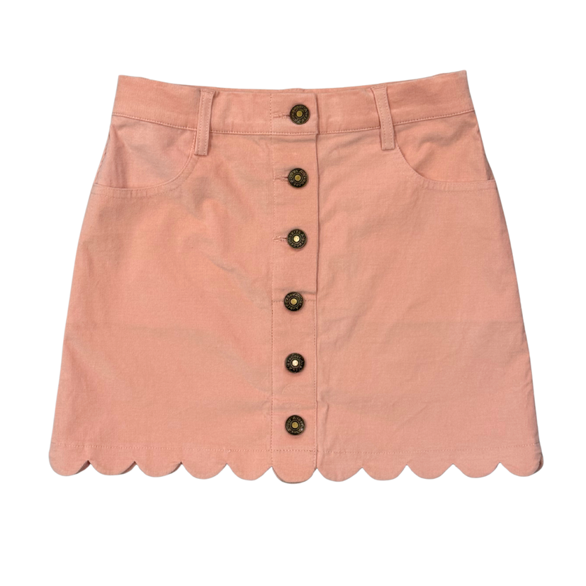 A dusty pink corduroy mini skirt with a scalloped hem, featuring a front button closure and belt loops, shown flat on a white background.