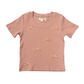 A dusty pink short-sleeve baby t-shirt with embroidered bow details on the front, displayed flat against a white background.