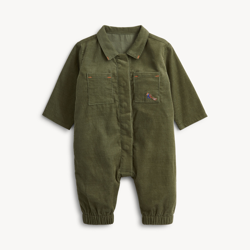 An olive green corduroy baby romper with a button-up front, long sleeves, elastic cuffs, and two chest pockets, shown on a clean white background.
