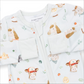 A baby zip-up sleeper by Angel Dears, featuring a white background with a colorful cartoon animal print of horses, chickens, ducks, and a donkey. The long sleeves are turned up, and the front zipper is fully visible.