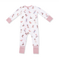 A baby long-sleeve footless pajama romper in white with a pink and brown cowboy boot print, featuring solid pink cuffs and patterned pink cuffs on the legs.