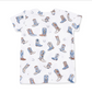 A white short-sleeve lounge shirt with an all-over print of cowboy boots in shades of blue, brown, and white, along with small horseshoe illustrations.