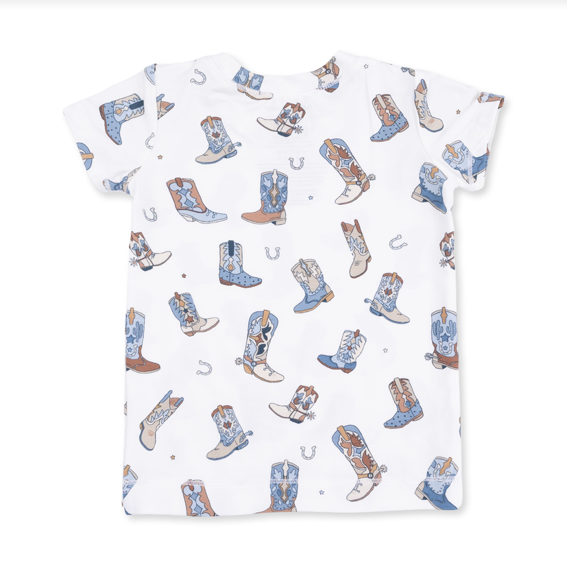 A white short-sleeve lounge shirt with an all-over print of cowboy boots in shades of blue, brown, and white, along with small horseshoe illustrations.