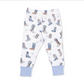 White children's lounge pants with an all-over cowboy boots print in shades of blue, brown, and beige, featuring solid light blue cuffs.