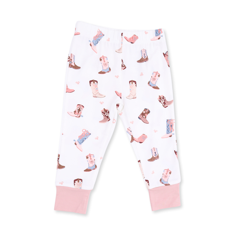 White children's leggings with an all-over cowboy boots print in pink, brown, and blue, featuring solid pink ribbed ankle cuffs.