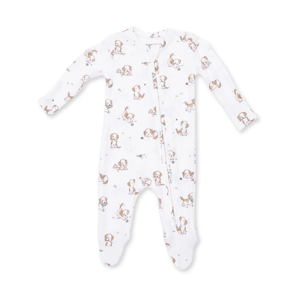 A white long-sleeve footed sleeper with an all-over print of small brown and tan dogs, shown on a plain white background.