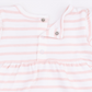 Close-up of a baby romper or bodysuit with horizontal light pink and white stripes, featuring a ruffled neckline and snap-button closure.