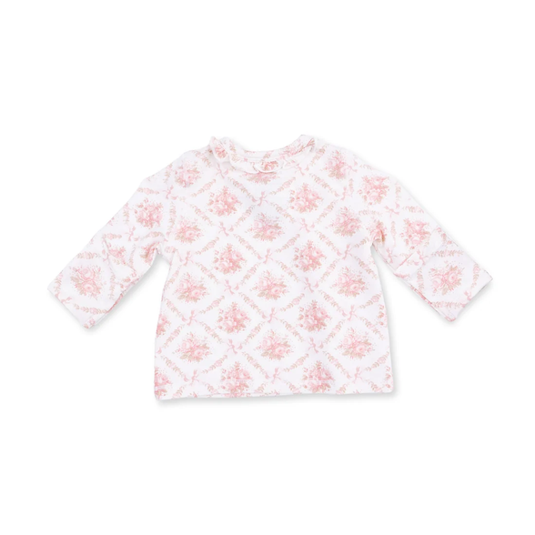 A long-sleeve baby top in white with a light pink floral and diamond pattern, laid flat against a white background.