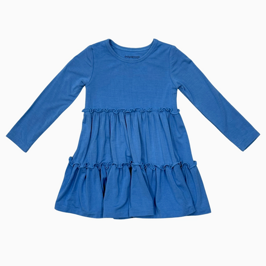 A blue long-sleeve baby dress with a ruffled waist and tiered skirt, laid flat against a white background.