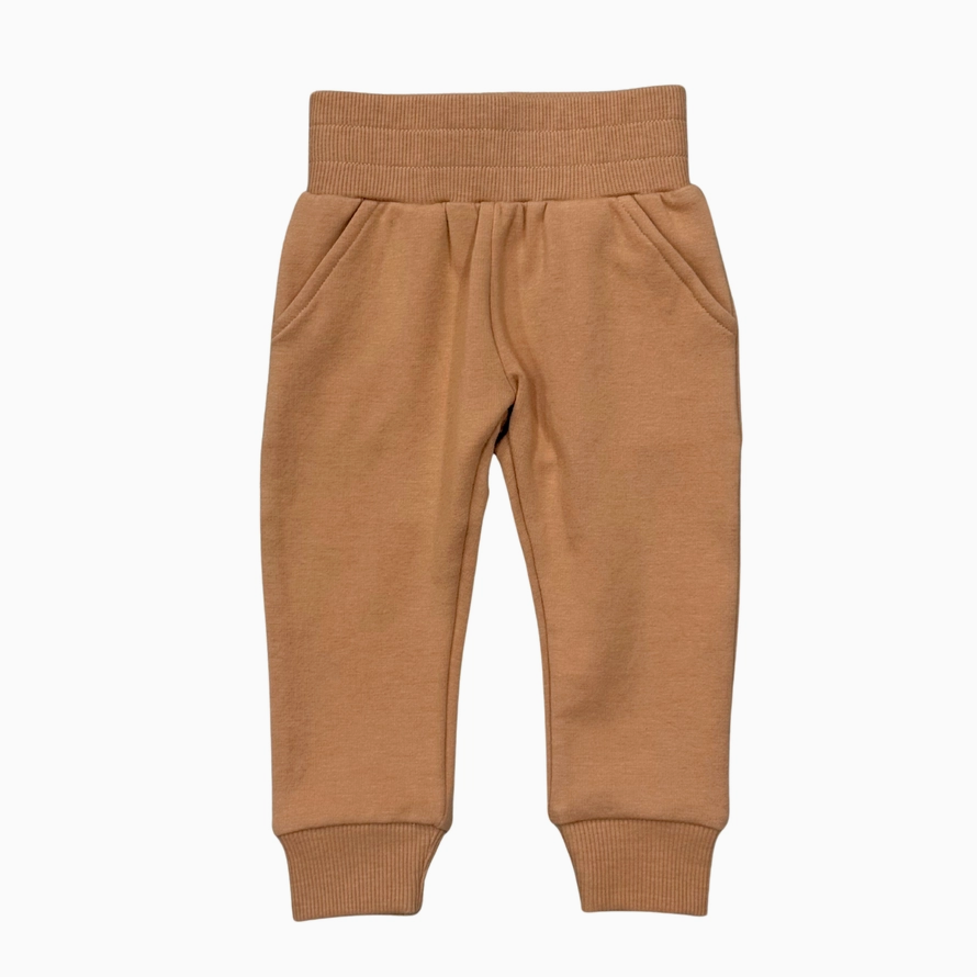 A pair of toddler jogger pants in a warm camel brown color, featuring an elastic waistband and ribbed ankle cuffs, shown flat on a white background.