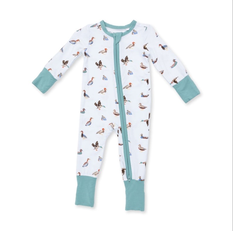 A baby long-sleeve footed sleeper with a white body covered in a colorful duck print, featuring mint green cuffs and a mint green zipper.