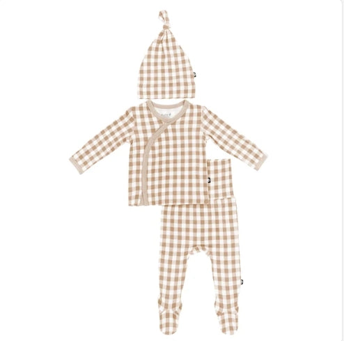 A three-piece baby clothing set featuring a long-sleeve wrap top, matching footed pants, and a knotted hat, all in a beige and white gingham check pattern on a white background.