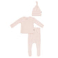 A baby clothing set in a very pale blush pink, including a long-sleeve wrap-style top, matching footed pants, and a knotted beanie hat, laid out on a plain white background.