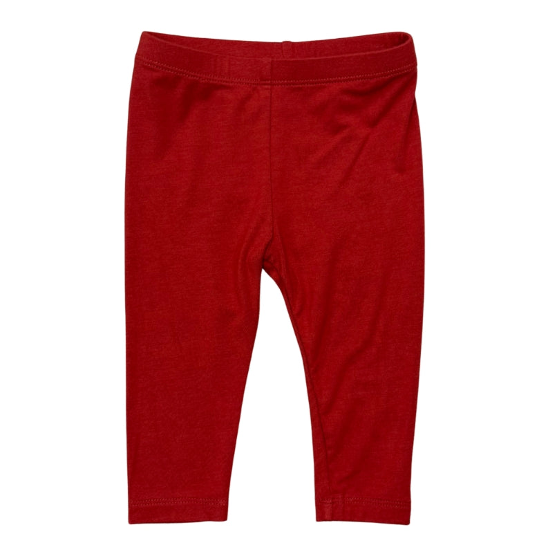 A pair of solid red baby leggings with an elastic waistband, shown flat against a plain white background.