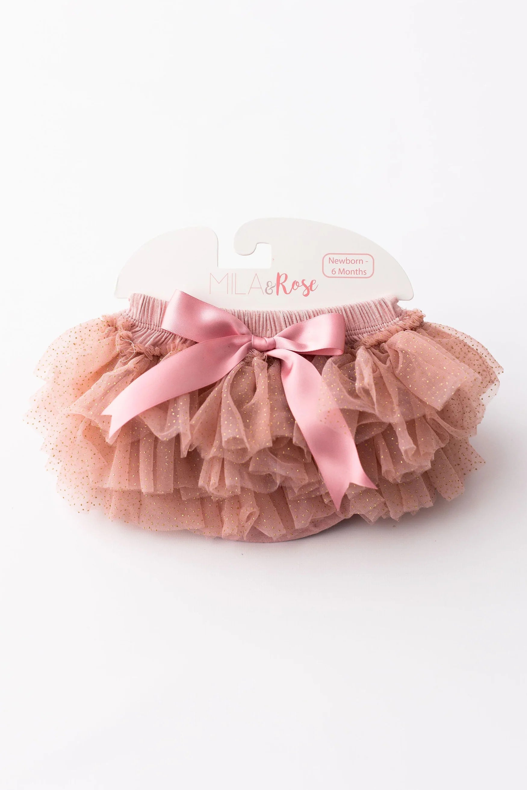 Pink tutu with a bow on a white background