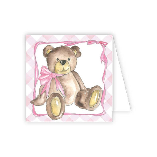 Card with a teddy bear and pink bow on a white background