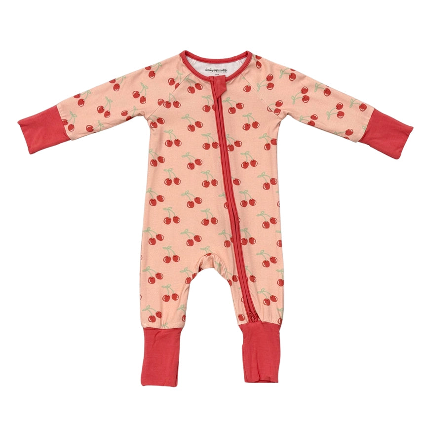 Children's onesie with cherry pattern on a white background