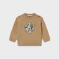 A tan knit crewneck sweater for toddlers, featuring a central graphic of five puppies in various colors, displayed on a light gray background.