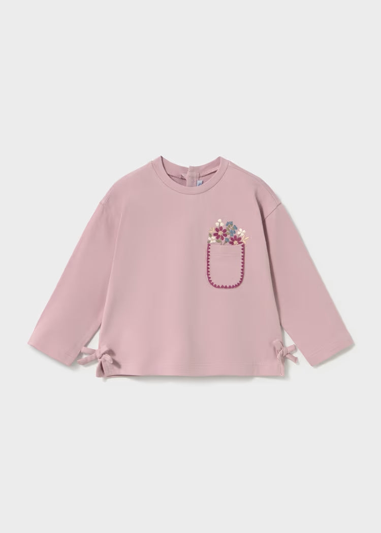  decorative embroidered pocket on the left chest with a pink beaded outline and a small floral motif