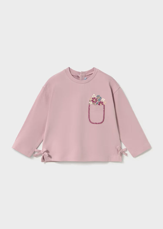  decorative embroidered pocket on the left chest with a pink beaded outline and a small floral motif