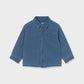 A blue denim long-sleeve button-up shirt with a chest pocket.