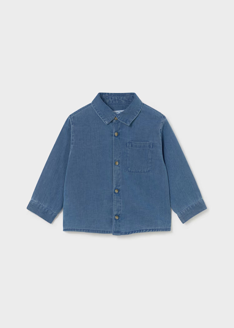 A blue denim long-sleeve button-up shirt with a chest pocket.