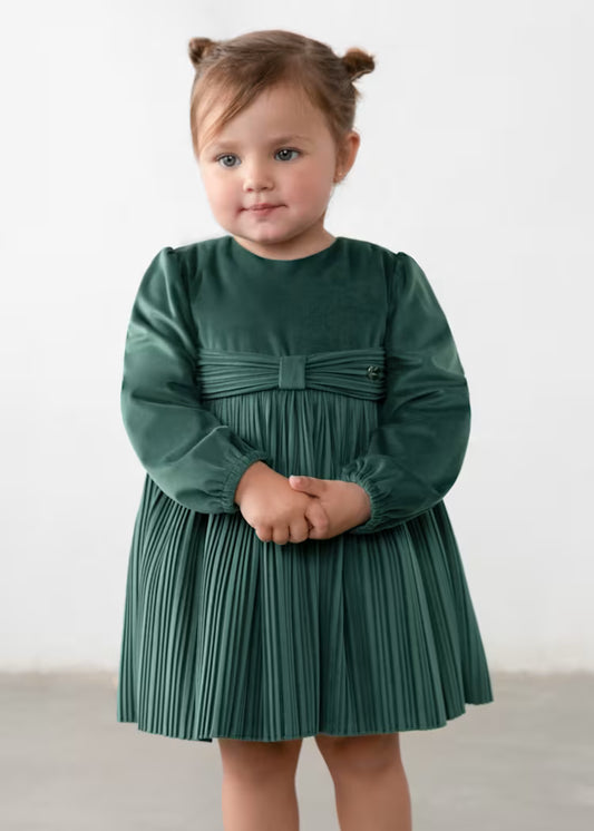 dark green long-sleeve dress with a pleated skirt and a decorative bow detail at the waist