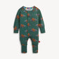 A baby long-sleeve footless one-piece jumpsuit in dark green, featuring an all-over print of cartoon dinosaurs with colorful wings. The jumpsuit has a snap-button front and is photographed flat against a light off-white background.