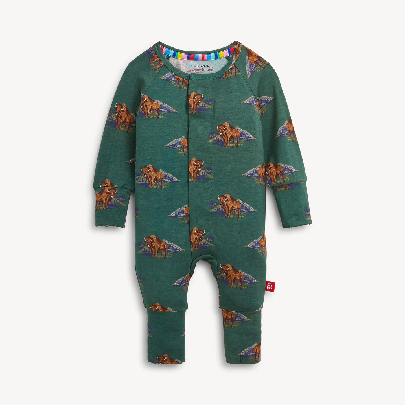 A baby long-sleeve footless one-piece jumpsuit in dark green, featuring an all-over print of cartoon dinosaurs with colorful wings. The jumpsuit has a snap-button front and is photographed flat against a light off-white background.