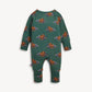 A long-sleeve baby romper in dark green with an allover print of cartoon dinosaurs on purple mountains, shown against a light off-white background.