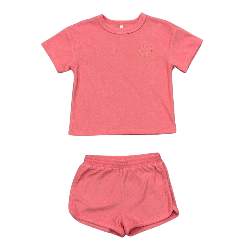 Pink t-shirt and shorts set on a white background