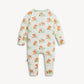 A baby long-sleeve footless one-piece romper in off-white, featuring an all-over print of orange dogs wearing green polka-dot sweaters. The garment is displayed flat against a light gray background.