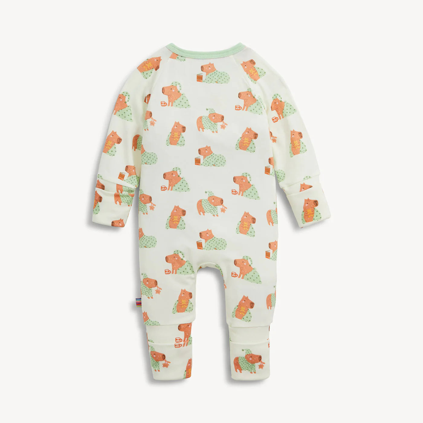 A baby long-sleeve footless one-piece romper in off-white, featuring an all-over print of orange dogs wearing green polka-dot sweaters. The garment is displayed flat against a light gray background.