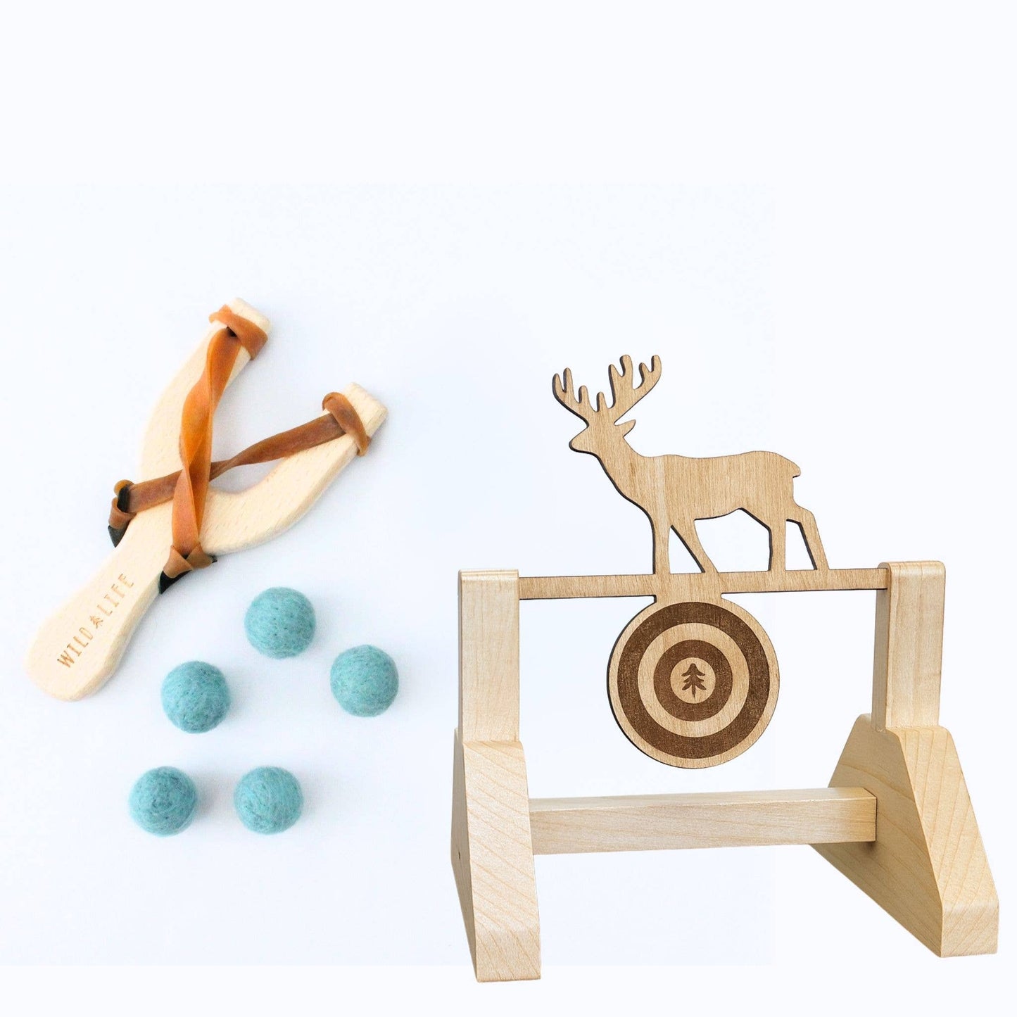 Wooden slingshot with felt balls and target stand with deer design on a white background