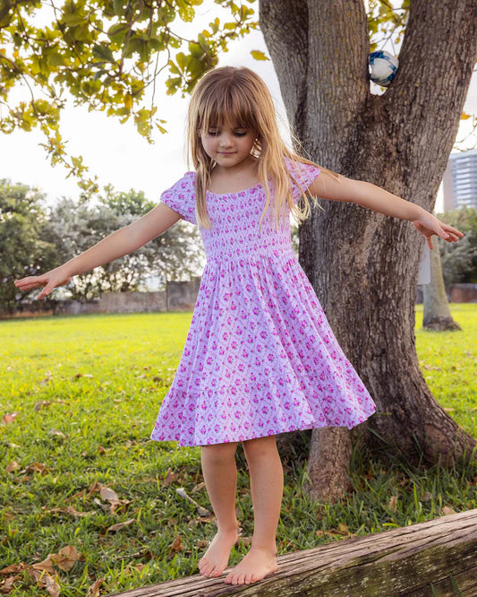Purple floral dress with smocked top