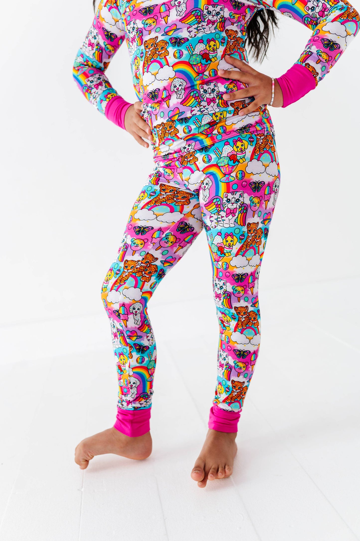 Person wearing a colorful pajama set with cartoon characters on a white background