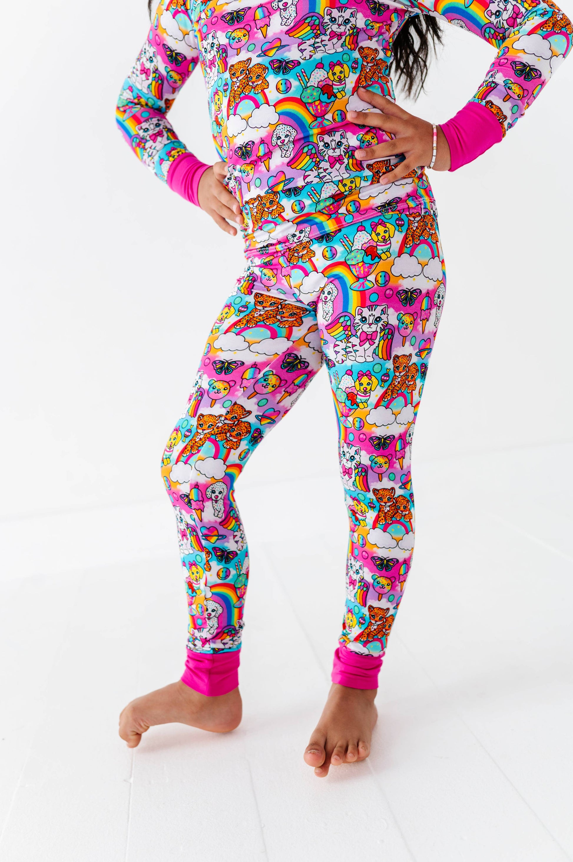 Person wearing a colorful pajama set with cartoon characters on a white background